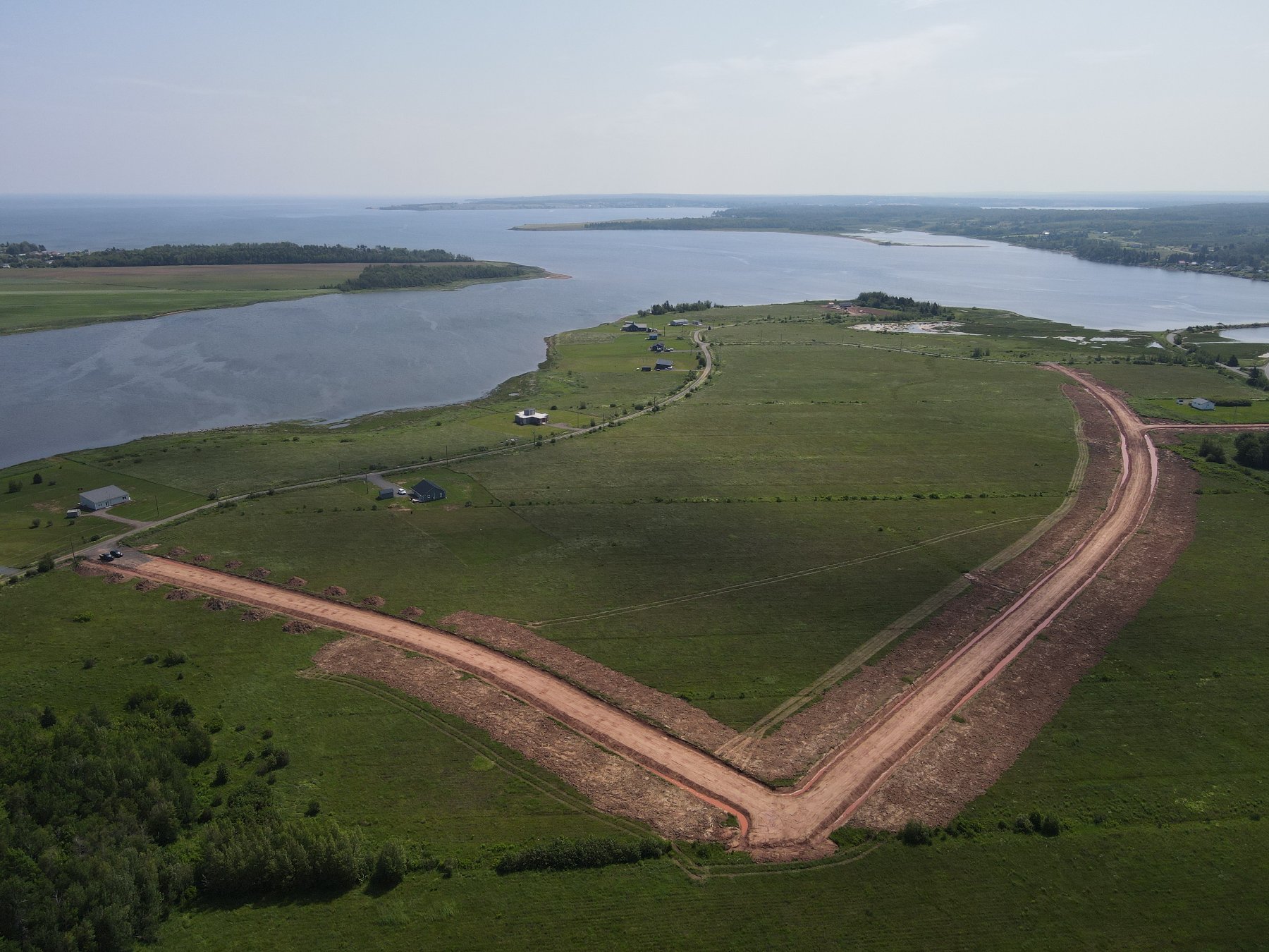 Aerial view of private oceanfront lots and road system at The Shores at Toney Bay, Nova Scotia